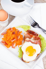 Toast with fried egg, prosciutto and pumpkin