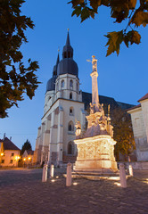 Trnava - The gothic Saint Nicholas church and baroque column