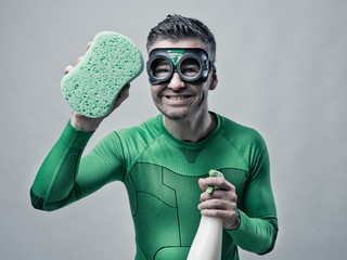 Superhero cleaning with sponge and detergent