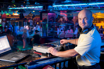 DJ behind the control panel