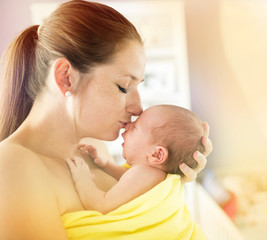 Young mother holding newborn baby