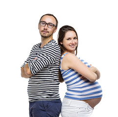 Pregnant couple posing in studio
