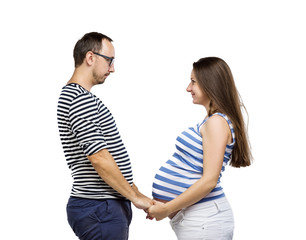 Pregnant couple posing in studio