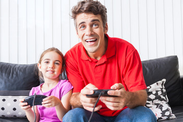 father and daughter playing video game