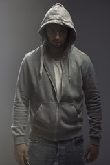 Fototapeta na wymiar Young man wearing casual clothes posing on a gray background