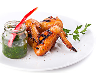 Plate of Grilled Chicken Wings with Sauce