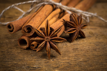Close up of cinnamon sticks and star anise on wood