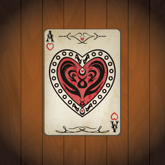 Ace of hearts poker card old look varnished wood background