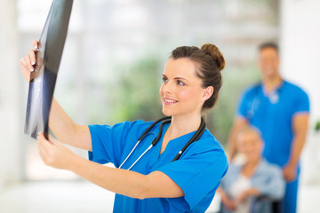 medical doctor holding patient's x-ray