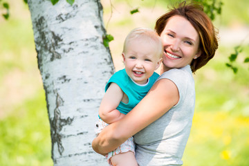 Happy mother and son at field