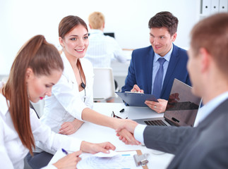 Business people shaking hands, finishing up a meeting