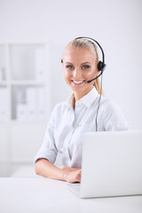 Portrait of beautiful businesswoman working at her desk with