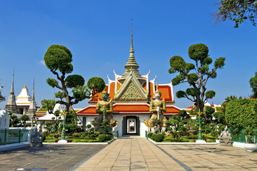 Statue and church  Wat Arun