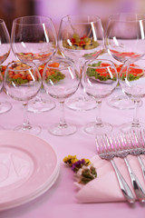 Buffet table with dishware waiting for guests