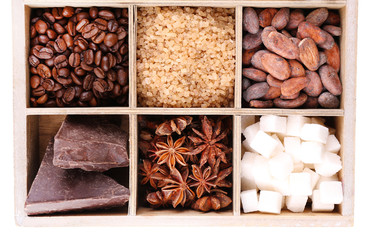 Wooden box with set of coffee and cocoa beans, sugar cubes,