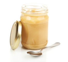 Creamy peanut butter in jar, isolated on white
