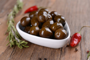Marinated olives on table close-up