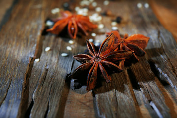 Star anise on dark wooden background, close-up