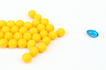 Individuality concept. Pills isolated on white