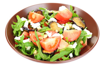 Eggplant salad with tomatoes, arugula and feta cheese, isolated