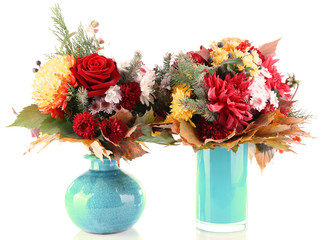 Flower bouquets in blue vases isolated on white