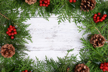 Fototapeta premium Beautiful Christmas border from fir and mistletoe