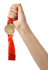 Fototapeta na wymiar Golden medal in hand isolated on white