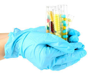 Hand holding test tubes with different color drugs, isolated