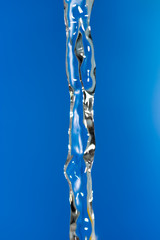 a jet of water on a blue background