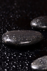 Obraz na płótnie Canvas Black spa stones with water drops