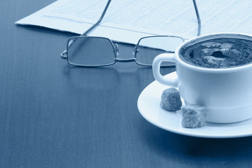 Having a cup of coffee