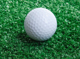 Golf ball ower green grass