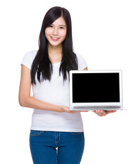 Asian woman show with blank screen of laptop computer