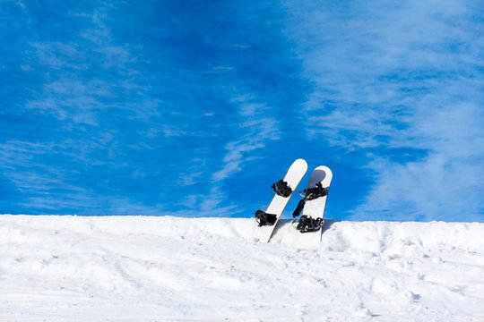two snowboard in snow mountain slope