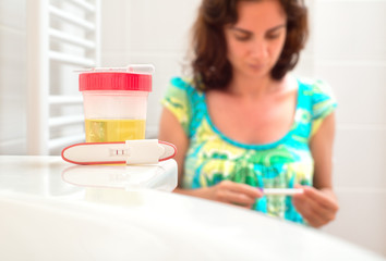 Young woman doing pregnancy test