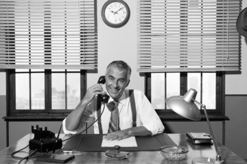 1950s smiling businessman on the phone