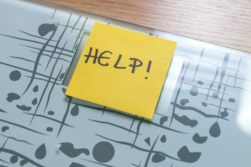 weight scale with yellow note