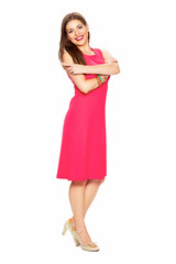 Full body portrait of smiling woman in red dress.