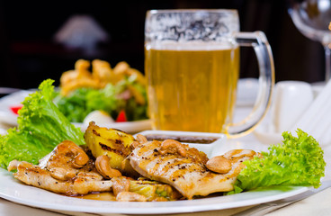 Pineapple Cashew Chicken Dish with Mug of Beer