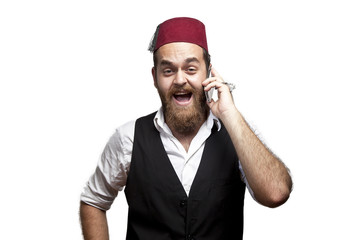 Man in traditional turkish hat and dress kabadayi talking phone