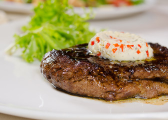 Close Up of Steak Topped with Herbed Butter