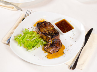 Gourmet Tender Juicy Grilled Meat on White Plate