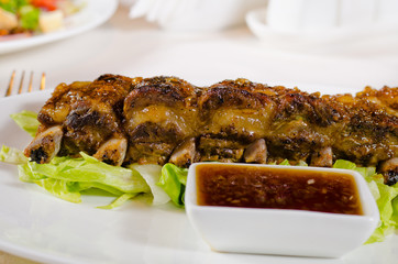 Close Up of Grilled Pork Ribs with Dipping Sauce