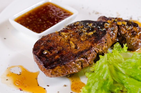 Tasty Grilled Steak Dish with Hot Chili Sauce