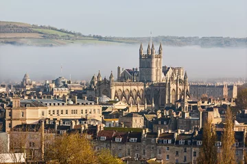 Tuinposter The city of Bath shrouded in morning mist © Anthony Brown