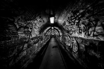 Foto op Plexiglas Dark undergorund passage with light © Sved Oliver