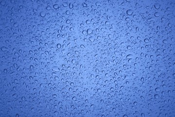Natural water drops on glass