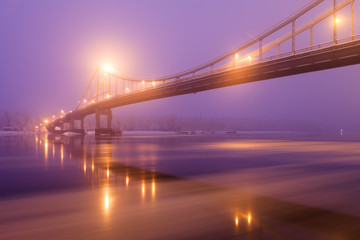 Fototapeta na wymiar Footbridge in winter Kiev at night