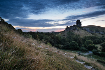 Fototapeta na wymiar Beautiful Summer sunrise over landscape of medieval castle ruins