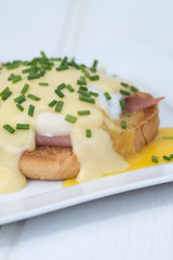 Eggs Benedict toasted English muffins ham poached eggs and holla